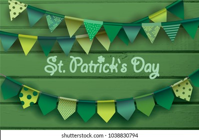 St. patrick's day card.  Colorful paper garlands on green wooden background.  Vector illustration.