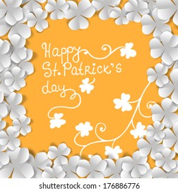 St. Patrick's day card, frame made of white paper clovers and floral ornaments on orange background 