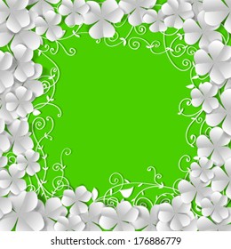 St. Patrick's day card, frame made of white paper clovers and floral ornaments on green background with space for text