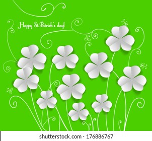 St. Patrick's day card, white paper clovers on green background with hand - drawn floral ornaments and stylized butterflies