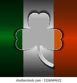 St. Patrick's Day, a clover carved from metal. Flag of Ireland.