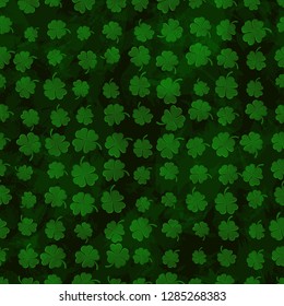 St Patricks Day Clover seamless pattern. Vector illustration for lucky spring design with shamrock. Green clover on grunge dark background. Ireland symbol pattern. Irish decor for web site.