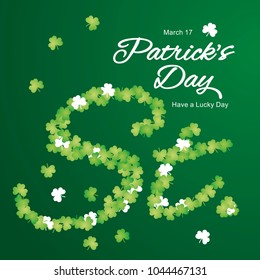 St Patricks Day clovers letters green background