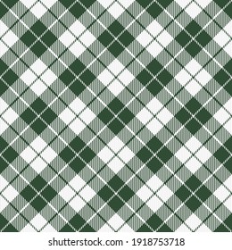St. Patricks day dioganal tartan plaid. Scottish pattern in green and white cage. Scottish cage. Traditional Scottish checkered background. Seamless fabric texture. Vector illustration