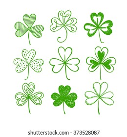 St. Patrick's day doodle shamrocks set. Hand drawn three leaf clover on white background for your design.