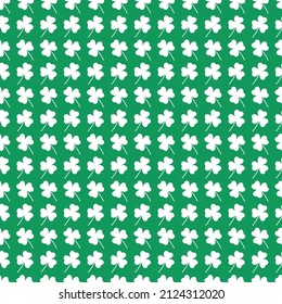 St Patricks Day green pattern with white shamrock leaves silhouettes. Seamless background and clover leaf. Saint Patricks holiday party backdrop. Vector flat illustration.
