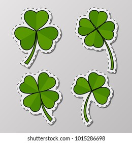 St. Patrick's Day greeting stickers with clover on white background