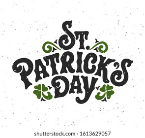 St. Patrick's Day handwritten lettering with shamrock leaves. St. Patrick's Day typography vector design for greeting cards and poster. Design template celebration. Vector illustration.