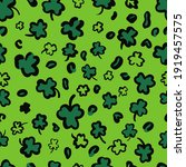 St. Patricks Day Leopard or jaguar seamless pattern made of shamrock or clover leaves. Trendy animal print. Spotted cheetah fur. Vector background for fabric, textile, wallpaper, wrapping paper, etc.