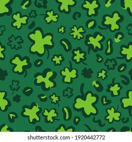 St. Patricks Day Leopard or jaguar seamless pattern made of shamrock or clover leaves. Spotted cheetah skin. Trendy animal print. Vector background for fabric, textile, wallpaper, wrapping paper, etc.