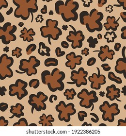 St. Patricks Day Leopard or jaguar seamless pattern made of clover or shamrock leaves. Trendy animal print. Spotted cheetah skin. Vector background for fabric, textile, wrapping paper, wallpaper, etc.