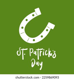St. Patrick's Day lettering and horseshoe. St. Patrick's Day greeting card. Vector illustration