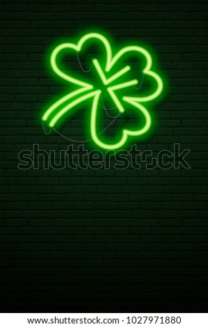 St Patricks Day Neon sign and green brick wall. Realistic sign. National holiday symbol in Ireland. Irish Shamrock. Template night Vertical banner. 