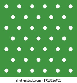 St. Patricks day pattern polka dots. Template background in green and white polka dots . Seamless fabric texture. Vector illustration