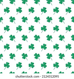 St Patricks Day pattern with shamrocks. Seamless white background and green clover leaves. Saint Patricks holiday party backdrop. Vector flat illustration.