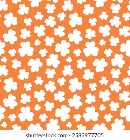 St Patricks Day pattern with shamrocks. Seamless orange background and white clover leaves. Saint Patricks March 17 holiday backdrop. Vector flat illustration