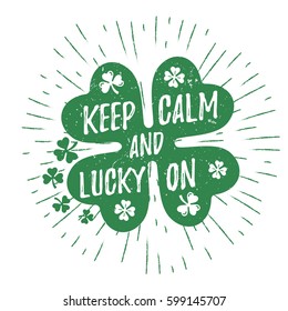 St. Patrick's Day quote typography lettering greeting card template on a grunge texture green shape with lucky shamrock clover for print, t-shirt, decorative design element. Keep calm and lucky on