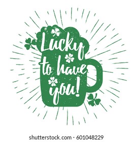 St. Patrick's Day quote typography lettering greeting card template on a grunge texture green shape with lucky shamrock clover for print, t-shirt, design element. Luck is believing you're lucky