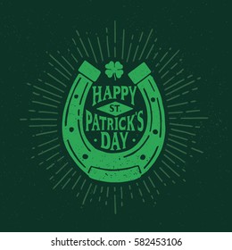 St. Patrick's Day. Retro style emblem of horseshoe. Typography. Vector illustration.