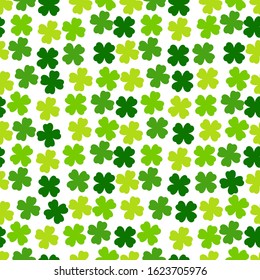 St Patricks Day seamless pattern. Green background with clover leaves. Cute simple repeated design. Vector illustration.