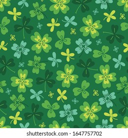 St. Patrick's Day seamless pattern with colorful clovers on green background. Perfect for wallpaper, greeting cards, wrapping paper, holiday design. Hand drawn vector illustration