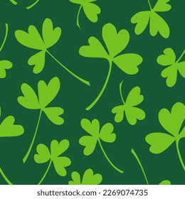 St Patrick's day seamless pattern design template. Yellow green clover leaves on green background. Vector stock illustration.	