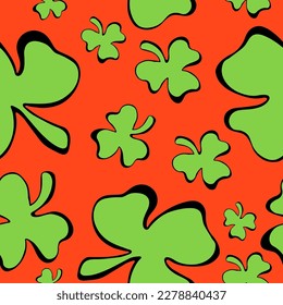 St. Patrick's Day Seamless Pattern. Hand drawn green clover leaves on red background. Perfect for creating Holiday and Spring Designs. EPS10
