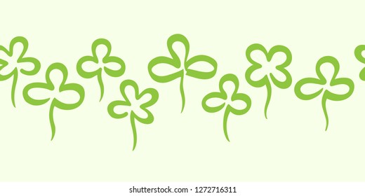 St. Patrick's day, spring border, frame seamless in horizontal direction. Design element. Various hand drawn clover leaves background. Stylized marker drawn doodle style shamrock, trefoil, quatrefoil.