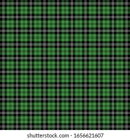 St. Patricks day tartan plaid. Scottish pattern in green and black cage. Scottish cage. Traditional Scottish checkered background. Seamless fabric texture. Vector illustration