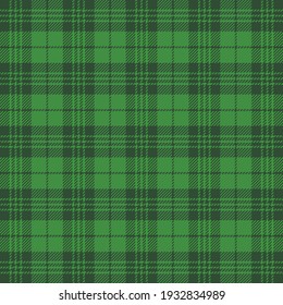 St. Patricks day tartan plaid. Scottish pattern in green and dark green cage. Scottish cage. Traditional Scottish checkered background. Seamless fabric texture. Vector illustration