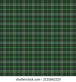 St. Patricks day tartan plaid. Scottish pattern in green, white and dark green cage. Scottish cage. Traditional Scottish checkered background. Seamless fabric texture. Vector illustration