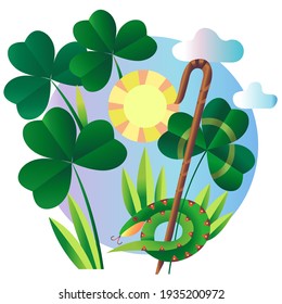 St. Patrick's staff, clover and snake against the spring sky. St. Patrick's Day celebrations.