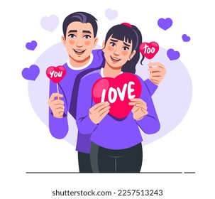 St. Valentines Day Concept. Portrait of a cute young couple wearing purple t-shirts in love and holding red paper heart cards. Valentine's day celebration. Flat style vector scene isolated on white.
