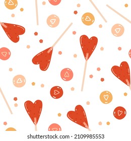 St. Valentine's Day seamless pattern with heart-shaped lollipops colorful dragees with drawn hearts and confetti