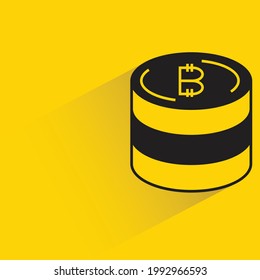 stack of bitcoins with shadow on yellow background