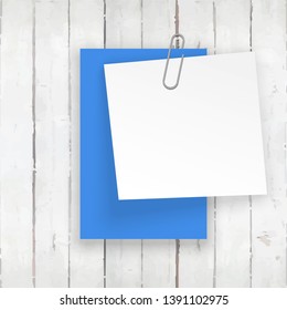 Stack of blue and white stickers attached metal paper clip with corner, ready for your message. Set of blue color stickers isolated on white wall background. illustration set paper Front wall view