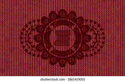 stack of books icon inside Red woolen fabric realistic emblem. Cloth exquisite background. Artistic illustration. 