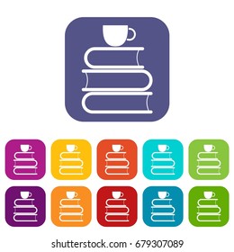 Stack of books and white cup icons set vector illustration in flat style In colors red, blue, green and other