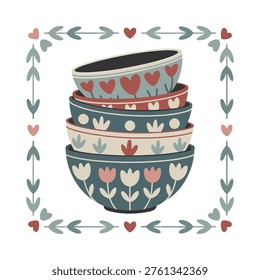 A stack of charming patterned ceramic bowls decorated with hearts and floral designs