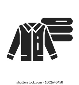 Stack of clothes and shirt black glyph icon. Isolated vector element. 