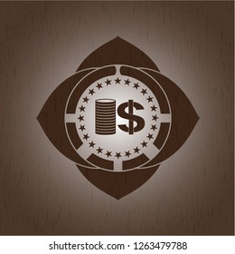 stack of coins icon inside wood emblem
