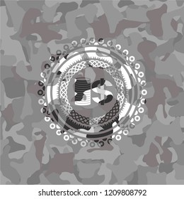 stack of coins icon on grey camouflage pattern