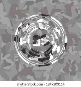 stack of coins icon on grey camouflage pattern