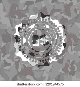 stack of coins icon on grey camo texture
