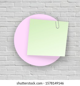 Stack of colored stickers attached metal paper clip with curled corner, ready for your message. Set of color stickers isolated on white Brick wall background. illustration set paper Front view.