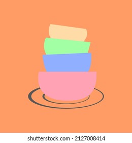 a stack of dishes, a stack of dishes with different colors