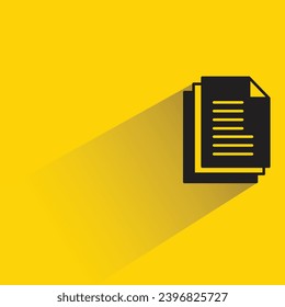 stack of documents with shadow on yellow background