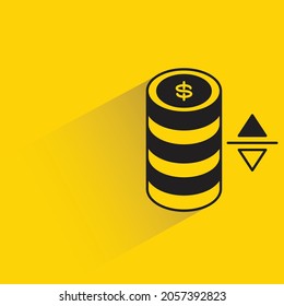 stack of dollar coins and price with shadow on yellow background