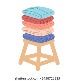 Stack of neat and clean clothes. Pile of neatly folded shirts, tshirts, outwear.