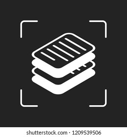 stack of papers, simple symbol or icon. White object in camera autofocus on dark background